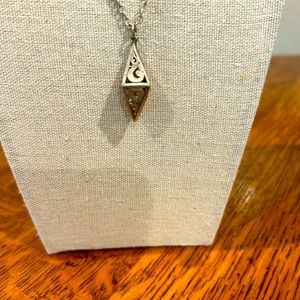 Vintage 18 in. Sterling Silver chain with approximately 1 inch scrolled pendant.